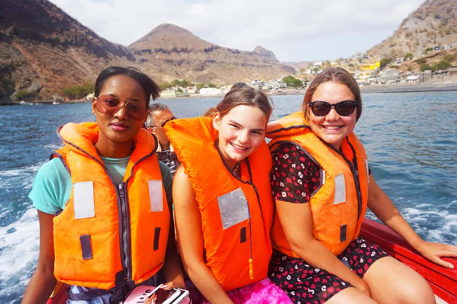 From Praia: Boat Trip, Snorkeling, Cave & BBQ on the Beach - A traditional boat across the volcanic coast