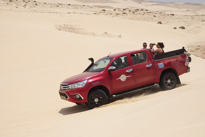 Half Day 4x4 Trip - Dunes, Caves, Santa Monica Beach & Village - Exploring the caves at Praia da Varandinha
